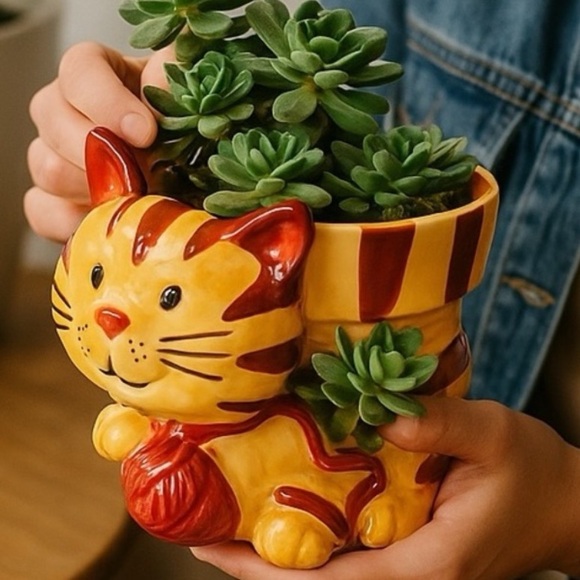 Planter Ceramic Cat Pot Glazed Yellow Tabby Pink Yarn 5.5”
Cottage Country - Picture 11 of 11